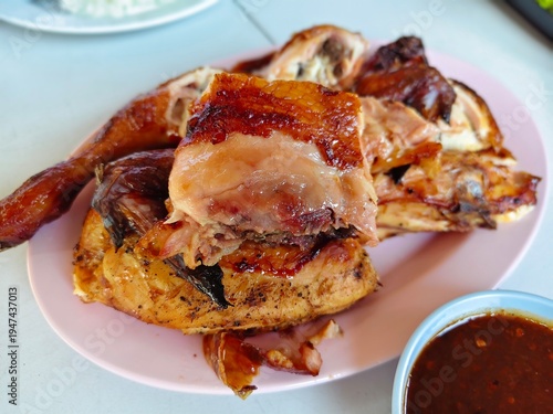 Thai style grilled chicken or Gai Yang served with spicy dipping sauce.