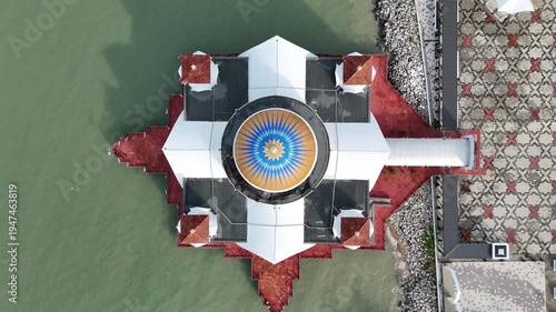 Top-down aerial view of Melaka Straits Mosque. Floating Mosque in Malacca city, Malaysia.