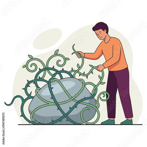 Man struggles to untangle thorns from large rock with vines