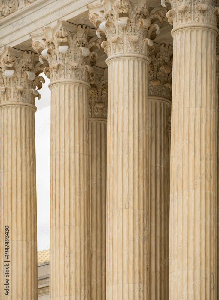 Fototapeta premium Columns stone repetition symmetry perspective. Columns marble architectural pattern. Columns decorative capitals carved detail. Columns neoclassical heritage exterior.