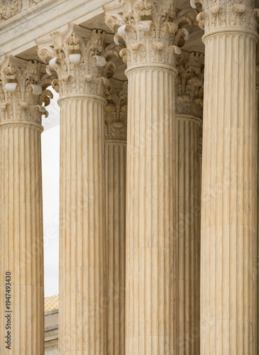 Columns stone repetition symmetry perspective. Columns marble architectural pattern. Columns decorative capitals carved detail. Columns neoclassical heritage exterior.