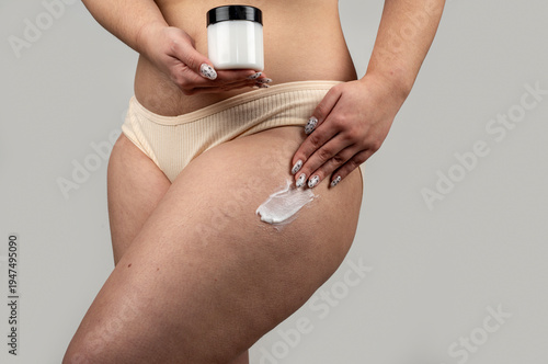 Cellulite on legs with fat and skin texture. Anti cellulite cream on thigh and hips. Cellulite cream on skin with fat. Natural cellulite on thigh with legs.