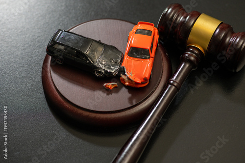 Gavel in traffic court for rights. Car crash in traffic court for civil litigation. Gavel for verdict in traffic court. Car for contract and agreement.