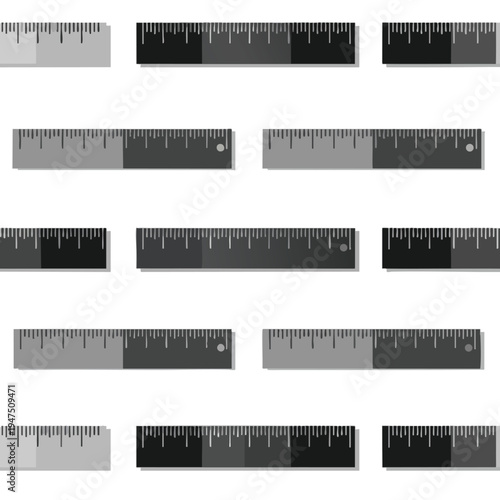 Collection of various grey and black measuring rulers with clear markings