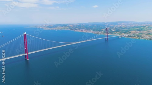 Wallpaper Mural Lapseki, Turkey. Heavy trucks and logistics vehicles on the 1915 Canakkale Bridge, a vital trade link over the Dardanelles. Aerial View, MasterShots, Circle (Far) Torontodigital.ca