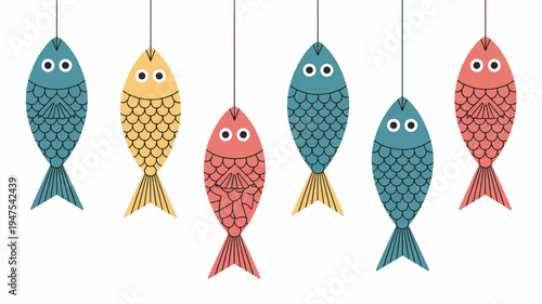 Colorful fish decorations hang from strings on white background festive aquatic symbols