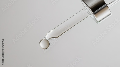 sedition. A single clear droplet falling from a glass dropper, studio lighting, clean aesthetic. bar promotions, beverage menus, designed for product packaging and bar promotions.