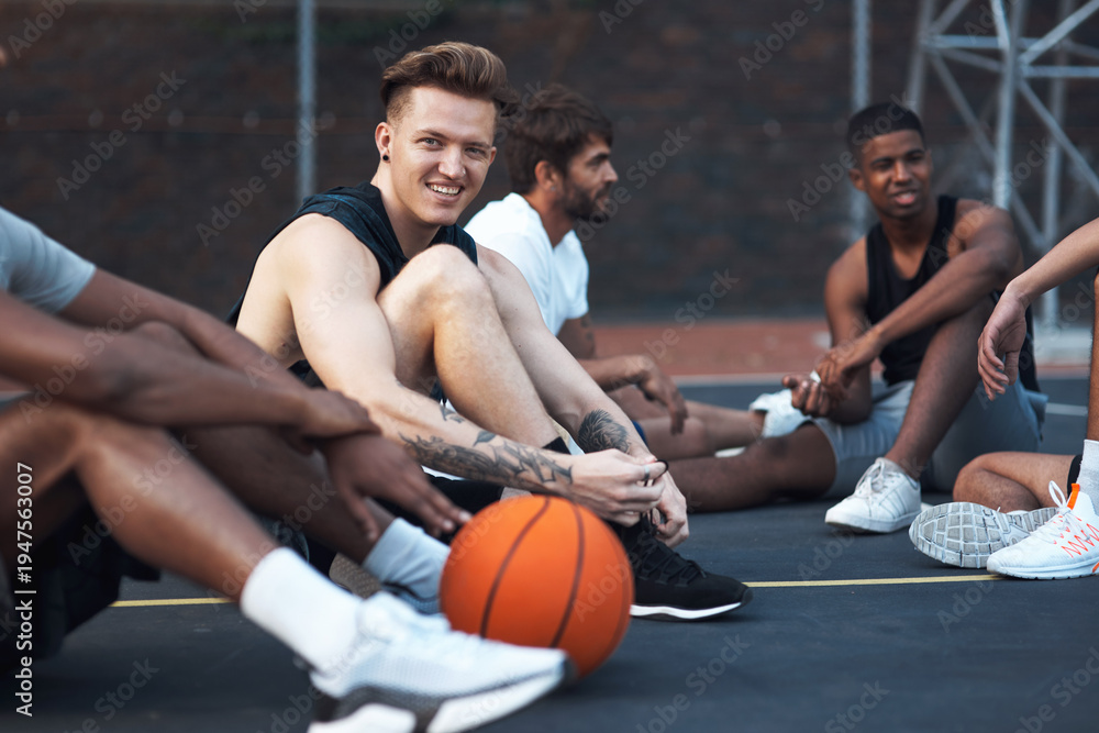 Fototapeta premium Basketball court, portrait and man with team, break or preparing for competition, happy and fitness. Outdoor, athlete and friends with strategy for match, smile and getting ready for sport tournament