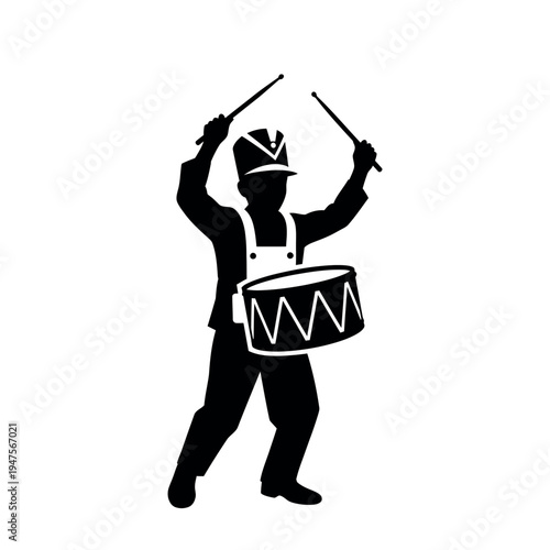 Silhouette of a drummer boy playing a snare drum.