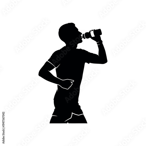 Silhouette of a male athlete drinking water during a run.