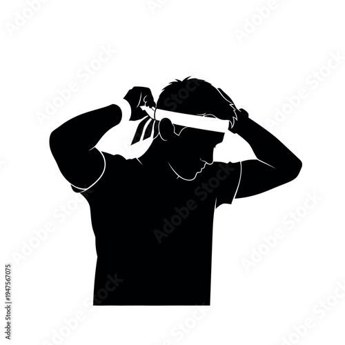 Silhouette of a man tying a headband.