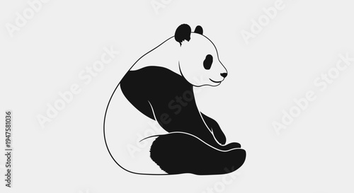 Black and white panda bear sitting.