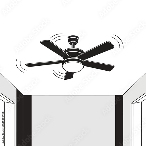 A black ceiling fan with five blades is shown in a room