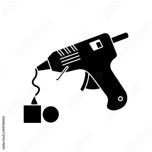 Black silhouette of a hot glue gun applying adhesive to objects