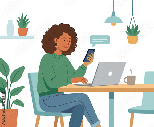 Woman sits at desk using laptop and phone in indoor home office space.