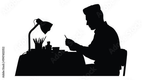 Man sitting at a desk writing with a pencil