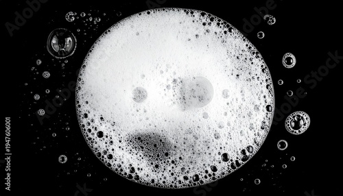 Frothy, bubbly, white foam circle on black