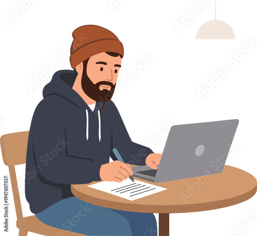 Man working on laptop and writing on paper at wooden table indoors