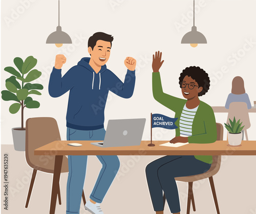 Two colleagues celebrate success in an office with laptops and plants nearby