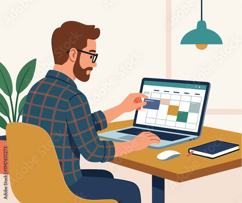 Man working on laptop at desk with calendar on screen indoors