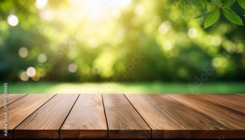 wooden table top on blur background of green garden with bokeh sunlight high quality photo