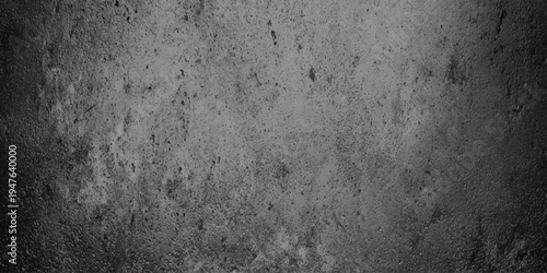 Abstract dark grey concrete texture background with distressed cement surface and moody vignette around the edges, highlighting the gritty details, and industrial speckles.