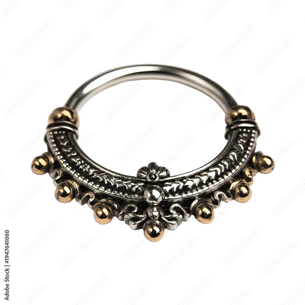 Obraz premium Ornate silver and gold nose ring, circular with detailed engravings and embellishments
