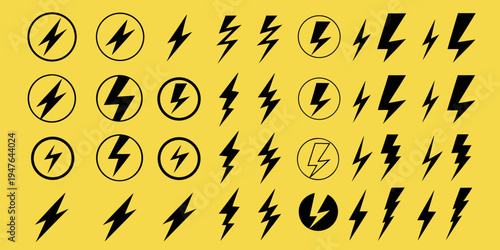 A collection of stylized black lightning bolts and oval shapes on yellow