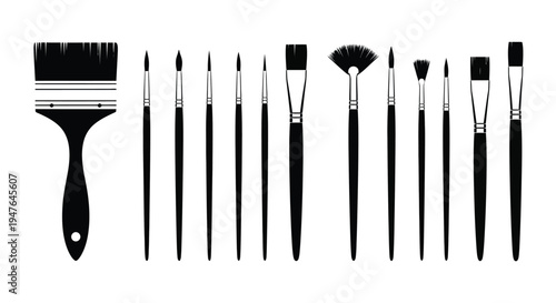 A collection of black paintbrushes and tools for artistic creation