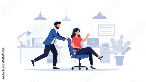 Playful male colleague pushing a smiling woman in her office chair during a break in a modern corporate workspace environment.