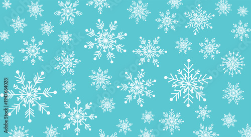 Winter background filled with large and small intricate white snowflakes scattered across a bright cyan blue background for the holidays.