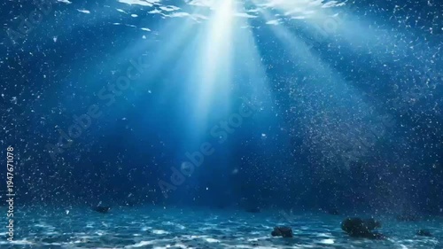 Sunbeams penetrating deep blue underwater ocean scene