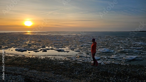 woman on the shore of the frozen Baltic Sea