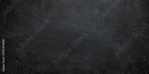 Dark grey concrete wall texture with weathered cement surface includes natural imperfections, cracks, and dark atmospheric stains for urban-style designs, architectural mockups.	