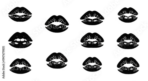 Collection of black lipstick kiss prints on a white background.