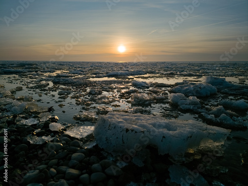 sunset over the sea frozen