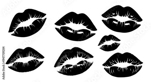 Black lipstick kiss prints on white background.