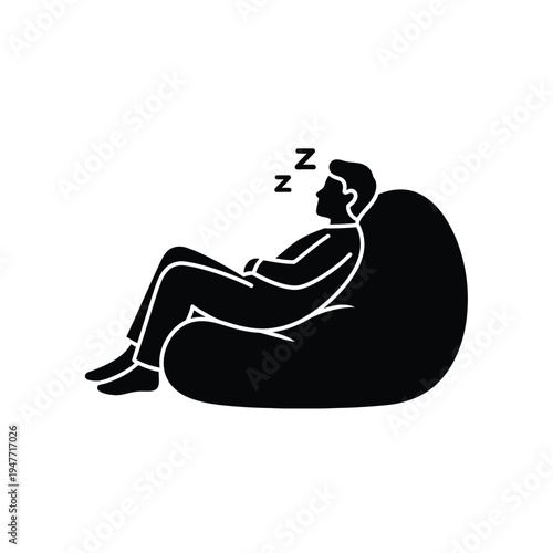 Man sleeping on bean bag chair.
