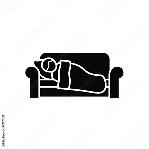 Person sleeping on a couch under a blanket.