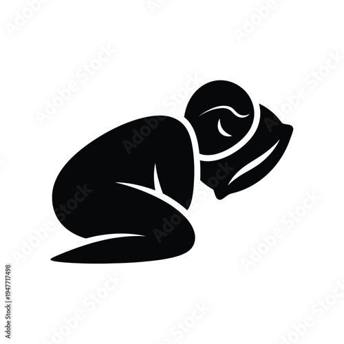 Person sleeping on a pillow in a fetal position.