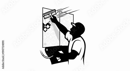 Person applying wallpaper with a brush, holding paste bucket
