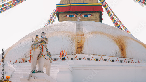 Ancient Buddhist Stupa with Golden Spire and Colorful Prayer Flags