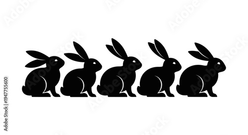 Five black rabbit silhouettes in a row on a white background.