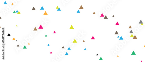 A festive scene with colorful triangular confetti scattered across a white background from a celebratory event.