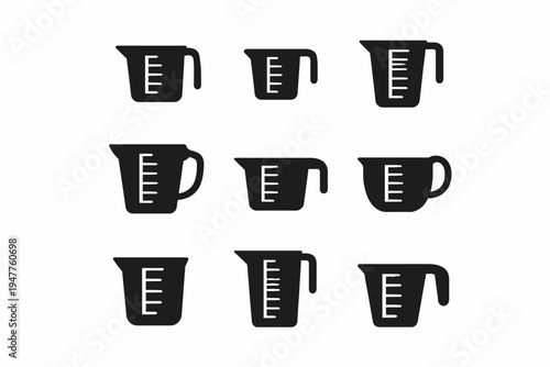 Set of nine black measuring cups with handles in various shapes