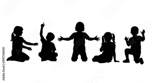 Silhouettes of children playing together.