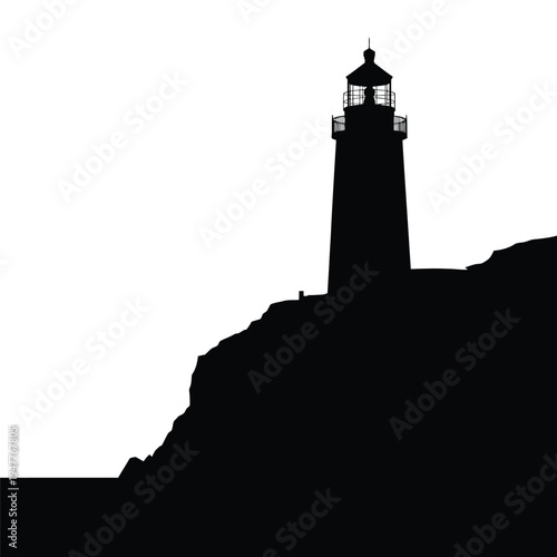 Silhouetted lighthouse stands prominently on a rocky coastal headland