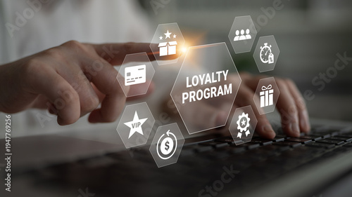 Cuadro en lienzo A close-up view of a person accessing a loyalty program on their laptop, showcasing various digital icons related to rewards and customer engagement strategies