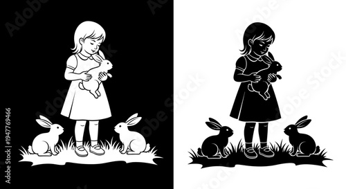 Little girl holding a rabbit with two other rabbits on the ground.