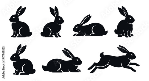 Collection of black rabbit silhouettes in various poses, showcasing different movements and resting positions.